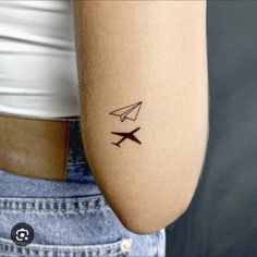 a woman with a small tattoo on her arm