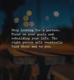 a wooden bench with the words stop looking for a partner focus on your goal and rebullizing your life