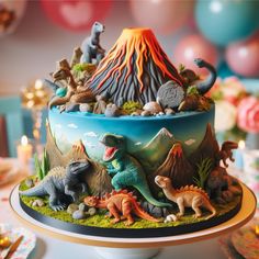 a birthday cake decorated with dinosaurs and volcano