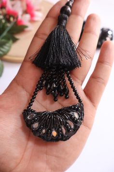 ➤Infuse your Indian garments with our Matt black Tassel Hanging. ➤Product Details: Materials: Beads, pearls, cutdana, crystal Color: Black Usage: Ideal for bridal Indian blouses, dupattas, lehengas, saris, and waist belts Quantity: Pair of 2 tassel latkans ➤➤ Delivery time : 8-14 business days anywhere in the world with standard shipping ➤➤ There may be some difference in color due to lighting and screen settings. Luxury Silver Danglers With Latkans, Traditional Luxury Chandbalis With Latkans, Cheap Jewelry With Latkans For Diwali, Luxury Chandbalis With Latkans For Women, Cheap Chandbalis With Latkans For Wedding, Indian Garments, Indian Blouses, Bridal Indian, Golden Lace