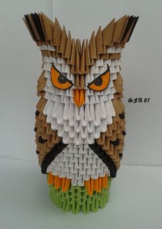 an owl made out of legos sitting on top of a table