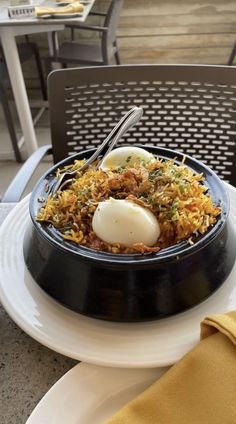 an egg and rice dish is served on a plate