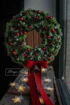 a christmas wreath on top of a wooden table