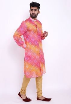 Readymade Art Kota Silk Front Open Kurta in Shaded Pink and Mustard. This Collar Neck and Full Sleeve attire is Prettified with Buttons, Bandhej and Foil Print and has Two Side Pockets. Available with an Art Silk Churidar in Beige. Do note: Footwear shown in the image is for presentation purposes only. Half to one inch may vary in measurement. (Slight variation in actual color vs. image is possible). We sell all kinds of menswear. Mens Kurta | Mens Kurta Pajama | Mens Sherwani | Mens Sherwani Se Festive Pink Printed Kurta, Pink Printed Long Sleeve Kurta, Printed Long Sleeve Pink Kurta, Pink Long Sleeve Printed Kurta, Traditional Pink Printed Kurta, Multicolor Fitted Straight Kurta, Fitted Multicolor Straight Kurta, Fitted Multicolor Kurta With Printed Motifs, Pink Long Sleeve Kurta With Bandhani Print