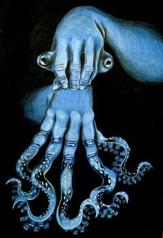 an octopus is being held in the air by someone's hand with blue paint on it