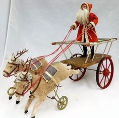 a santa clause riding in a sleigh pulled by two reindeers on a white background