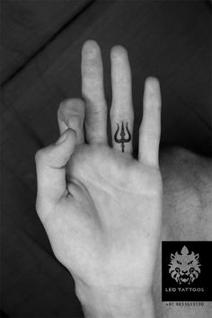 a person holding their hand up with two fingers in the shape of an x and y