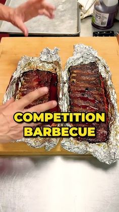 someone is cutting up some meat in tin foil on a wooden board with the words competition barbecue written above it