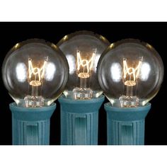 three light bulbs sitting next to each other on top of a blue stand with black background