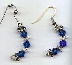 deep blue and clear crystals on goldtone ear wires, curved shape ﻿Please allow 1 extra week for custom making.approx 1.5" Blue Wire Wrapped Drop Earrings, Blue Wire Wrapped Dangle Crystal Earrings, Blue Metal Crystal Earrings With Ear Wire, Blue Crystal Earrings With Metal Ear Wire, Blue Crystal Pierced Earrings, Nickel Free Blue Crystal Earrings, Nickel-free Blue Crystal Earrings, Beaded Jewelry Earrings, Diy Jewelry Unique