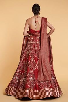 Red and gold 14 kali lehenga with thread jaal, floral thread and crystal window pattern embroidery with aari and crystal border. Comes with stripe work blouse with crystal highlights and dangler tassels belt, thread work dupatta and a net dupatta with stripe work.
Component: 5
Pattern: Embroidered
Type Of Work: Floral Jaal Pattern, Crystals, Aari, Thread Work
Neckline: Plunged V-Neck
Sleeve Type: Sleeveless
Fabric: Lehenga, Blouse, Belt; Dupion Silk; Dupatta 1: Net; Dupatta 2: Tinsil Georgette
C Red Anarkali Gown For Ceremonial Occasions, Ceremonial Red Gown With Pallu, Red Bollywood Ceremonial Gown, Red Ceremonial Lehenga For Festive Occasions, Red Ceremonial Gown With Dupatta, Ceremonial Red Gown With Dupatta, Ceremonial Fitted Choli With Self Design, Ceremonial Fitted Self Design Choli, Red Brocade Lehenga With Resham Embroidery