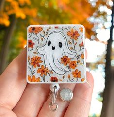 Our floral ghost badge reel can be made with any design you would like! Makes a great fashion statement & gift for friends/family/nurses. Ring in the Holiday season with this fun badge reel! Made of acrylic material. You may choose the option for a swivel or a belt clip. Be sure to check out our Fall - Halloween - Thanksgiving listings here and get free shipping on your order of $35 or more! Link--->  https://www.etsy.com/shop/GlitterMyBadge?ref=profile_header§ion_id=35735359 Novelty Personalized White Badge Reel, Customizable White Badge Reel For Gift, Personalized Fun White Badge Reel, Personalized White Fun Badge Reel, Fun White Badge Reel For Personal Use, Cute White Badge Reel For Gift, Charge Nurse, Floral Ghost, Retro Ghost