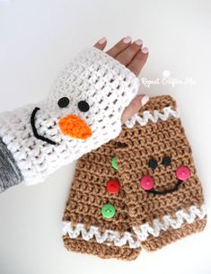 two crocheted christmas mitts with buttons on them, one has a snowman and the other is a gingerbread