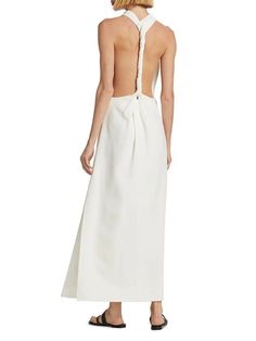 Proenza Schouler Selena Twist Back Crepe Dress - White | Editorialist Floor-length Backless Dress With Tie Back, Sleeveless Backless Dress With Tie Back For Dinner, Cocktail Maxi Dress With Side Slits And Halter Neck, Cocktail Maxi Dress With Draped Ruched Back, Cocktail Maxi Dress With Ruched Back, Draped Maxi Dress With Ruched Back For Cocktail, Chic Sleeveless Evening Dress With Tie Back, Formal Backless Ruched Maxi Dress, Chic Backless Dress With Side Slits For Formal Occasions