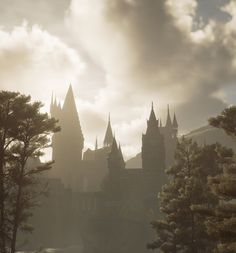 an old castle with towers and trees in the foreground, on a cloudy day