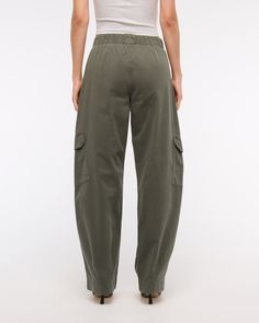 Mid rise pants in our twill fabric, that have a relaxed fit at the waist and hips, loose fit through the thigh and calf, and tapers into a barrel-leg shape. Features cargo inspired details, functional pockets and zip closure. Elevated Casual Relaxed Fit Cargo Bottoms, Elevated Casual Straight Cargo Pants With Elastic Waistband, Relaxed Fit Cargo Pants For Elevated Casual, Elevated Casual Tapered Leg Cargo Pants, Relaxed Fit Cargo Style Straight Leg Bottoms, Relaxed Fit Cargo Trousers, Khaki Mid-rise Relaxed Fit Cargo Pants, Khaki Cargo Pants With Elastic Waistband And Tapered Leg, Elevated Casual Bottoms With Cargo Pockets