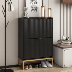 a black cabinet sitting next to a lamp and shoes on top of a wooden floor