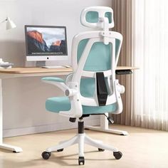 an office chair sitting in front of a desk with a computer monitor and keyboard on it