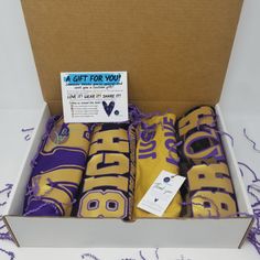 a gift for you wrapped in purple and gold