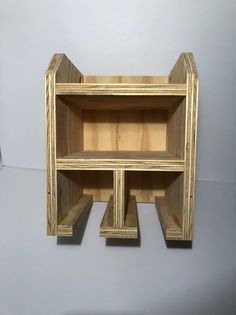 two wooden shelves sitting on top of each other