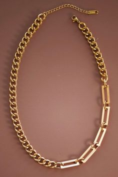 This is a simple but chunky chained necklace. The gold necklace is linked with rectangled links. Length: 7 1/2” Modern Gold-tone Chain Necklace With Rectangular Links, Chic Rectangular Adjustable Chain Necklace, Rectangular Chunky Chain Metal Necklace, Chic Gold Rectangular Chain Necklace, Chic Rectangular Gold Chain Necklace, Metal Necklaces With Chunky Chain And Rectangular Links, Gold Rectangular Chain Necklace, Chic Style, Chic Gold Chain Necklace With Rectangular Links, Minimalist Gold-tone Chain Link Necklace