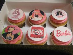 six cupcakes with pink frosting in a box