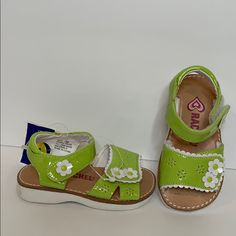 Adorable Nwt Green Sandals With White Flower Pattern And Adjustable Velcro Closures At The Toe And Ankle. Cute White Rubber Sole With Little Fish Pattern. Size 5 Summer Sandals With Soft Sole For Playtime, Soft Sole Open Toe Sandals For Spring, Spring Open Toe Sandals With Soft Sole, Cute Green Open Toe Sandals, Playful Closed Toe Sandals With Soft Sole, Cute Open Toe Sandals For Playtime, Summer Playtime Sandals With Round Toe, Cute Synthetic Sandals With Soft Sole, Spring Sandals With Soft Synthetic Sole