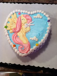 there is a cake shaped like a little mermaid