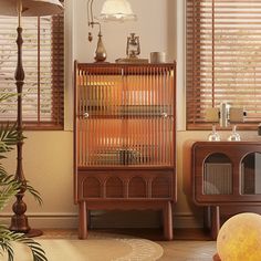 a living room filled with furniture next to a window covered in blindes and blinds