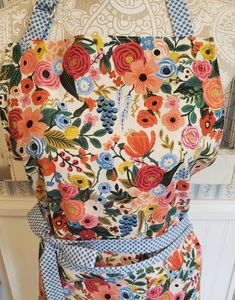 an apron made out of fabric with flowers on it