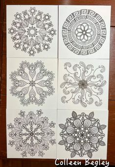 four different designs on white paper with black and white ink, one is in the center