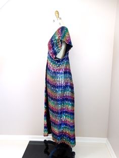 "What a colorful dress! It's fully embellished with bright sequins in a horizontal rainbow design. It's in excellent condition! Measurements: Bust - 32-36\" Waist - 30-34\" Hips - 40-44\" Length - 51\" This dress comes from a pet-free and smoke-free home. If you would like more info or have any questions, please don't hesitate to ask!" Iridescent Dress, Checkered Jacket, Colorful Dress, Sequined Dress, Sequin Maxi Dress, Sequin Maxi, Sequin Jacket, Sequin Gown, Chevron Design