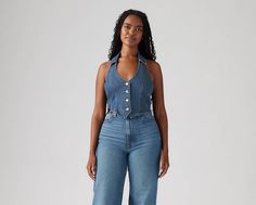 We're bringing it back with our Bria Denim Corset, a vintage-inspired top with a flattering V-neckline, a button-up front and a halter design. A retro halter top Cut with a slim fit Denim Halter Top, Denim Corset, Shirt Blouses Tops, Halter Top, Levi's, Vintage Inspired, Button Up, Slim Fit, Bring It On