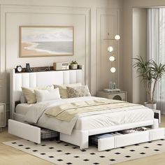 a white bed sitting in a bedroom on top of a hard wood floor