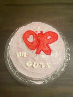 a cake with white frosting and red icing that says 90 or cuts on it