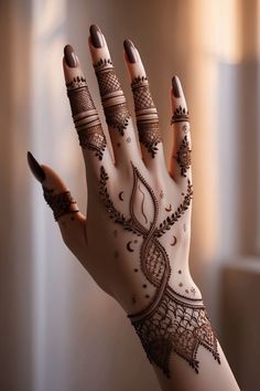 a woman's hand with henna on it