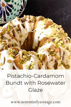 a close up of a bundt cake with icing and pistachio - cardamom