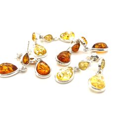 These gorgeous Baltic amber earrings feature two glowing stones, each in a classic teardrop shape. The timeless charm of amber gives these simple earrings a touch of glamour, making them the perfect accessory to transition from your busy everyday to a dressy evening event. You'll appreciate the secure post clasp as you move through your tasks with the lovely effervescent shimmer of amber brightening your energy. Amber is an ancient, powerful healing stone created from the lifeblood of trees. It Luxury Amber Earrings For Anniversary, Cheap Amber Drop Earrings, Elegant Amber Teardrop Earrings, Teardrop Baltic Amber Earrings, Orange Teardrop Earrings For Formal Occasions, Elegant Orange Teardrop Earrings, Formal Orange Teardrop Earrings, Amber Teardrop Earrings, Amber Earrings