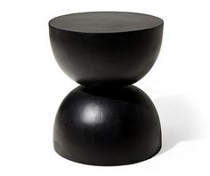 a black stool sitting on top of a white floor