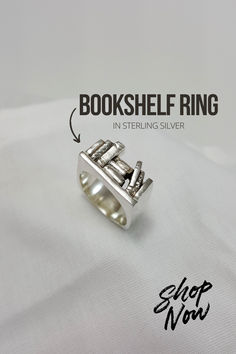 Calling everyone on BookTok! Our Bookshelf Ring in sterling silver is the perfect gift for the book lover in your life, or of course, add it to your own jewelry collection. This ring is one-of-a-kind and created by hand by our in-house jeweler. Find this ring and more unique jewelry pieces on our website! Tiny Bookshelf, Gifts For Book Lovers, Silver Shop, Book Lovers Gifts, Book Lover, Ring Gift, Bookshelves, Handmade Natural, Jewelry Pieces