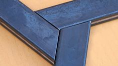 a blue frame sitting on top of a wooden table