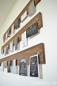 a wall with several different types of signs on it and hanging from the side,