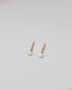 Mini Pearl Studs Perfect 14k gold smaller sized pearl studs for your everyday wear. Minimalist and elegant as a pair or as a single stud on your second or third ear piercing. 14k gold post and backings choose from 2 sizes: Smaller 1.75-2mm Small 2.75-3mm Minimalist Pearl Earrings As Gift, Tiny Elegant Pearl Earrings For Gifts, Minimalist Rose Gold Pearl Earrings For Anniversary, Minimalist 14k Gold Filled Pearl Earrings For Anniversary, 14k Gold Pearl Earrings With Pearl Charm As Gift, Minimalist Yellow Gold Pearl Earrings For Anniversary, Dainty Rose Gold Pearl Earrings For Gift, Dainty Rose Gold Pearl Earrings As Gift, Minimalist Hypoallergenic Pearl Earrings For Gifts