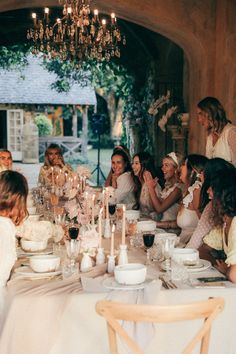 a group of people sitting around a table