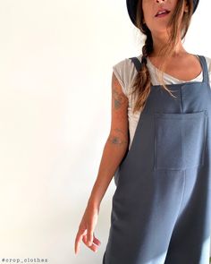 Handmade charcoal blue oversize womens jumpsuit romper overalls playsuit. Our super comfortable, oversize jumpsuits are lovingly made in a generously oversized and baggy style for a more casual look. Part jumpsuit, part overalls, these are great for everyday wear or as working dungarees. The playful mid-calf length palazzo style pants look great with ankle booties or trainers, and with sandals in the warmer months. The square neckline, solid straps, and a big square pocket on the chest, are a no Casual Dark Wash Sleeveless Jumpsuit/romper, Oversize Jumpsuit, Cotton Straight-leg Medium Wash Jumpsuits And Rompers, Romper Overalls, Relaxed Fit Button-up Jumpsuits And Rompers With Pockets, Women Overalls, Non-stretch Cotton Overalls In Dark Wash, Womens Romper, Casual Medium Wash Bib Front Jumpsuit/romper