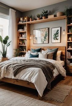 a bedroom with a bed, bookshelf and plants on the shelves above it