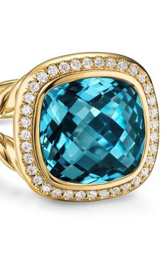 A split shanke is shaped by a signature twist in this 18-karat-gold ring that frames a central stone with a halo of pavé diamonds. 15.5mm square setting Total black onyx weight: 3.35ct. Total malachite weight: 5.4ct. Total Hampton blue topaz weight: 7.61ct. Total citrine weight: 5.5ct. Total malachite weight: 10.65ct. Total turquoise weight: 3.55ct. Total diamond weight: 0.19ct. 18k gold/black onyx, malachite, Hampton blue topaz, citrine, malachite or turquoise/diamond Imported >Diamond Guide Elegant Topaz Ring With Pave Setting For Formal Occasions, Luxury Topaz Ring With Halo Design For Formal Occasions, Luxury Topaz Ring With Halo Design, Luxury Formal Topaz Halo Ring, Amulet Charm, Diamond Guide, Bead Bangles, Customer Care, White Rose Gold