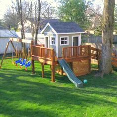 a backyard with a play set and slide