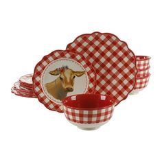 a red and white checkered tableware set with a cow head on it