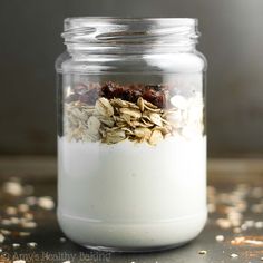 a glass jar filled with oatmeal and granola